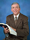 Photo of Pastor Walker Reading the Bible